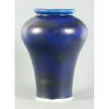 Lewis GROVES (British 20th Century) a vivid blue baluster shaped vase, the base bearing potter's