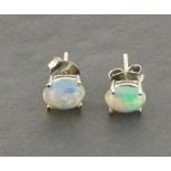 A pair of silver studs set with Ethiopian opal