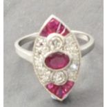 A platinum ruby and diamond marquise shaped panel ring