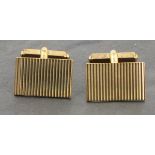 A pair of 9ct gold cuff-links by Asprey & Co. rectangular with a ribbed pattern, presented in a