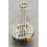 A brooch modelled in the form of a lute,  set with opals and diamonds, 4gms