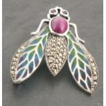 A silver plique a jour insect brooch, modelled as a moth with ruby set eyes, 7gms