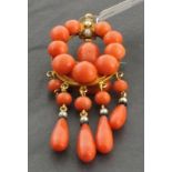 A coral brooch, set with seed pearls, 11gms