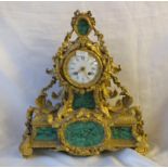 Large French gilt mantle clock with malachite panels Striking on a bell 13“ high by Raingo