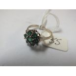 Emerald and diamond cluster ring set in 14ct white gold approx size N