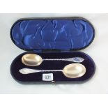 A pair of parcel gilt serving spoons with frosted bowls, twisted stems 8" long. Sheff. 1899 by