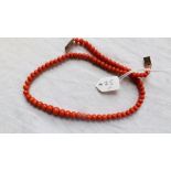 String of antique coral beads 20.1 grams in total including gold clasp (16 inches in length).