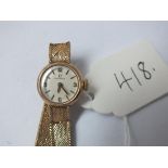 9ct ladies Omega wrist watch with 9ct belt style strap