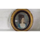 English School – Early 19th Century. A pastille of a ‘Lady in Blue Dress’. Painted oval. 9” x 8”.