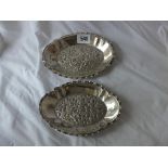Pair of large oval bonbon dishes with foliate embossed centres, 6.5” wide Lon 1904 by CE 145g.