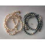 Two long necklaces of cultured pearl