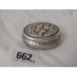 Continental oval pill box, hinged cover decorated with putti, 2” long 28g.
