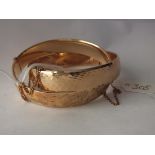 Two rolled gold bangles