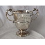 Heavy vase shaped trophy cup, 10” over flying scroll handles Lon 1895 840g.