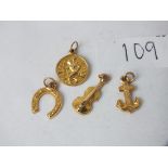 Four small 9ct charms 1.7g