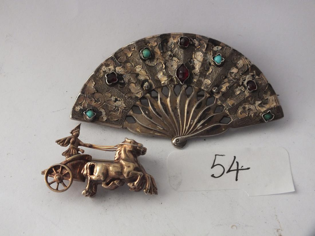 An unusual large vintage silver stone set brooch and a three dimensional silver charioteer brooch