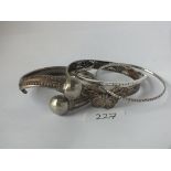 Four silver & white metal bangles