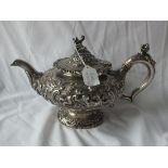 GOOD VICTORIAN PUTTI HEAVY TEAPOT, circular body heavily embossed with putty amongst scrolls and the