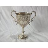 Small two handled heavy trophy cup, foliate embossed, 4” over handle Shef 1904 by HW 110g.ex.