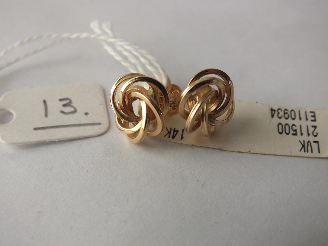 A pair of unused 14ct. gold knot earrings 2g. (cost $200)