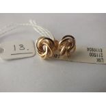 A pair of unused 14ct. gold knot earrings 2g. (cost $200)