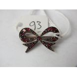 Garnet bow brooch