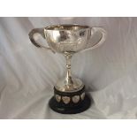 Two handled pedestal trophy cup, 10.5” over handle 460g.