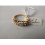 A five stone diamond half hoop ring, set in 14ct. size N
