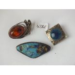 Pewter and enamel brooch by S & Co and two others