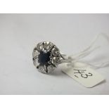 GOOD SAPPHIRE & DIAMOND CLUSTER ring set in white gold mount. Central sapphire approx 6mm long and