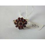 9ct mounted circular garnet cluster ring approx size P 3.1g inc