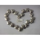 Bag containing 20 white metal heart charms