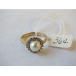 9ct. pearl white stone flower head ring