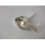 1970’s DIAMOND AND PEARL RING set in 15ct. white gold, size O 8gm