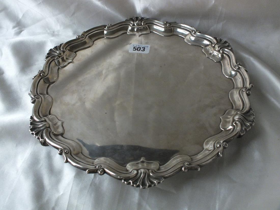 LARGE SALVER with moulded shell rim on three supports, 12” dia. 880g.