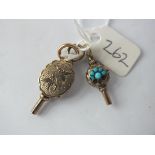 Two antique watch keys, one inset with turquoise