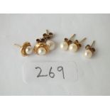 Three pairs of pearl set ear studs