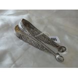 Perth pair of bright cut sugar tongs by JC, also a cast pair, Lon circa 1770 72g.