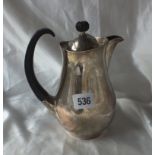 HEAVY MODERNIST HOT WATER JUG, designed by Eric Clements, the pear5 shaped body with flying scroll