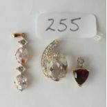 Three 9ct. mounted stone set pendants