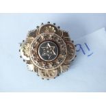 Gold mounted target brooch with pearl cluster to centre