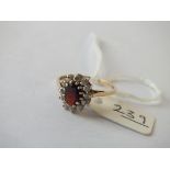 Oval red and white stone dress ring, set in 9ct. size O 2g.