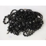 Bag of ten black jet glass necklaces