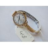 9ct. ladies Record wrist watch on metal strap