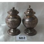 Pair of Georgian baluster shaped peppers, each with floral girdle on pedestal foot, 3.5” high Lon