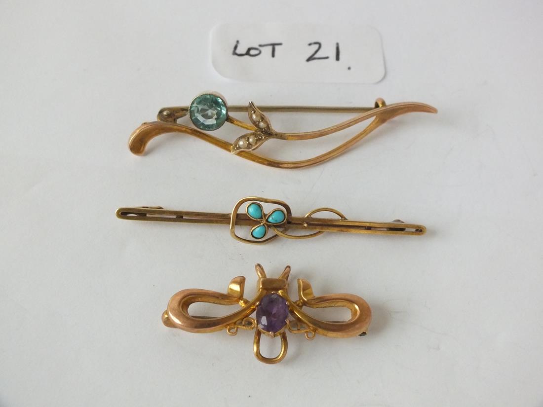 Three decorative bar brooches set with an amethyst, turquoise etc.