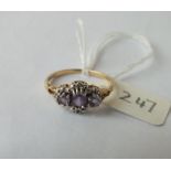 Amethyst diamond triple cluster ring, set in 9ct. size P