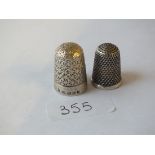 Two silver thimbles