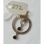 9ct. circular pendant set with pearl and garnets