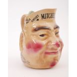 Mitchell's Old Irish Whisky, character jug. A ceramic character jug in the form of a smiling ruddy-